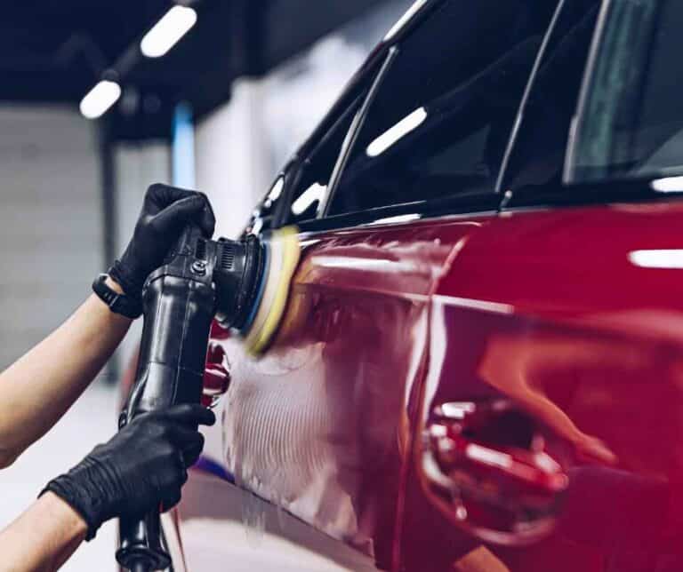 a person painting car door